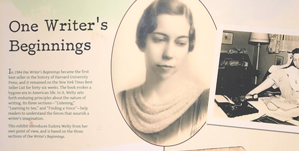 The One Writer’s Beginnings exhibit panel at the Eudora Welty House & Garden Education and Visitors Center shows a portrait of young Welty and a photograph of the author at work.