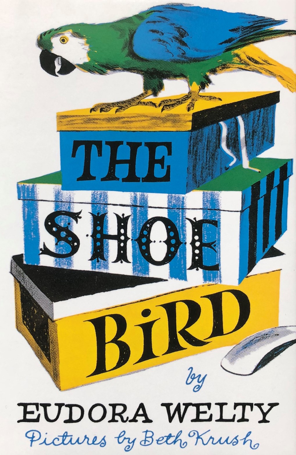 Cover of Eudora Welty's book, The Shoe Bird. Arutruo the green parrot stands atop a stack of colorful shoeboxes