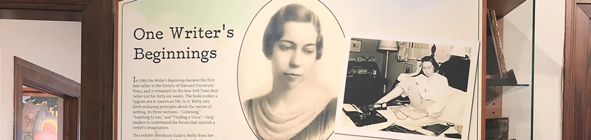 The One Writer’s Beginnings exhibit panel at the Eudora Welty House & Garden Education and Visitors Center shows a portrait of young Welty and a photograph of the author at work.