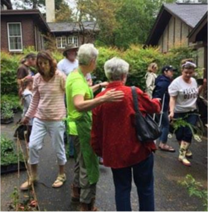  A group of patrons gathers behind the Eudora Welty House & Garden to purchase plants at the annual plant sale.