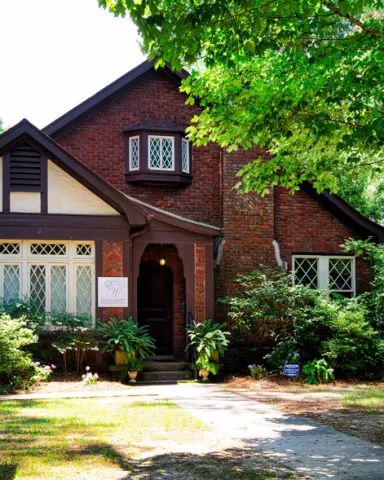 Front of the Tudor Revival house next door to the Welty House which serves as the Eudora Welty House & Garden Education and Visitors Center.